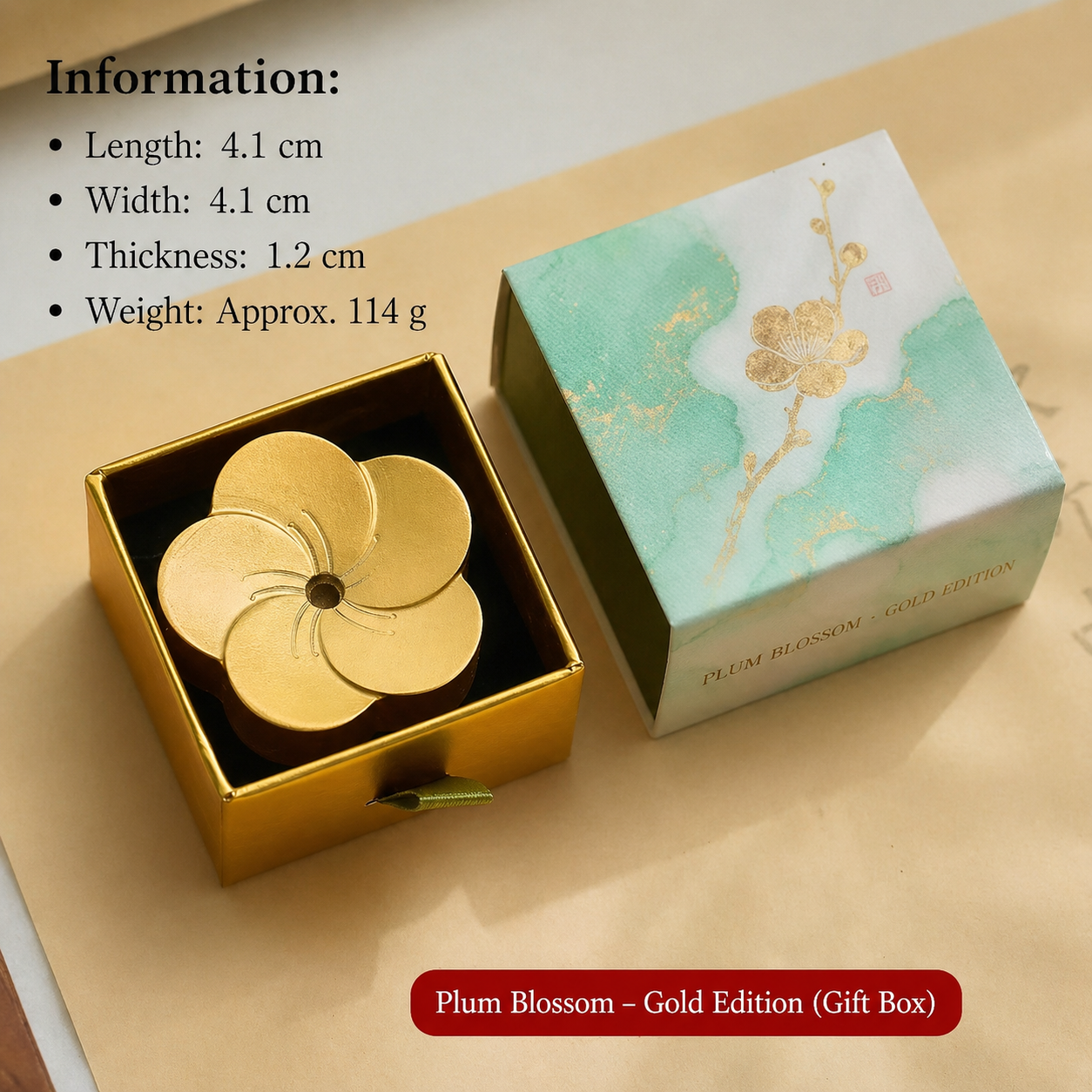 Gold plum blossom-shaped object in a gift box with product details on a beige background