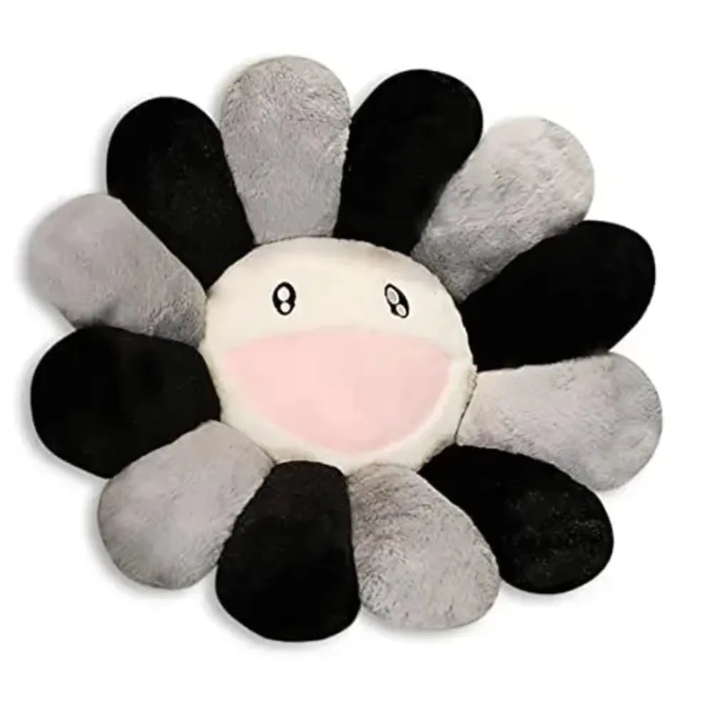 Flower-shaped plush toy with black, gray, and white petals on a white background