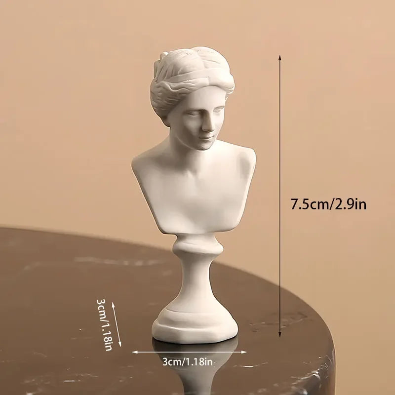 White marble bust on a reflective surface with measurements indicated