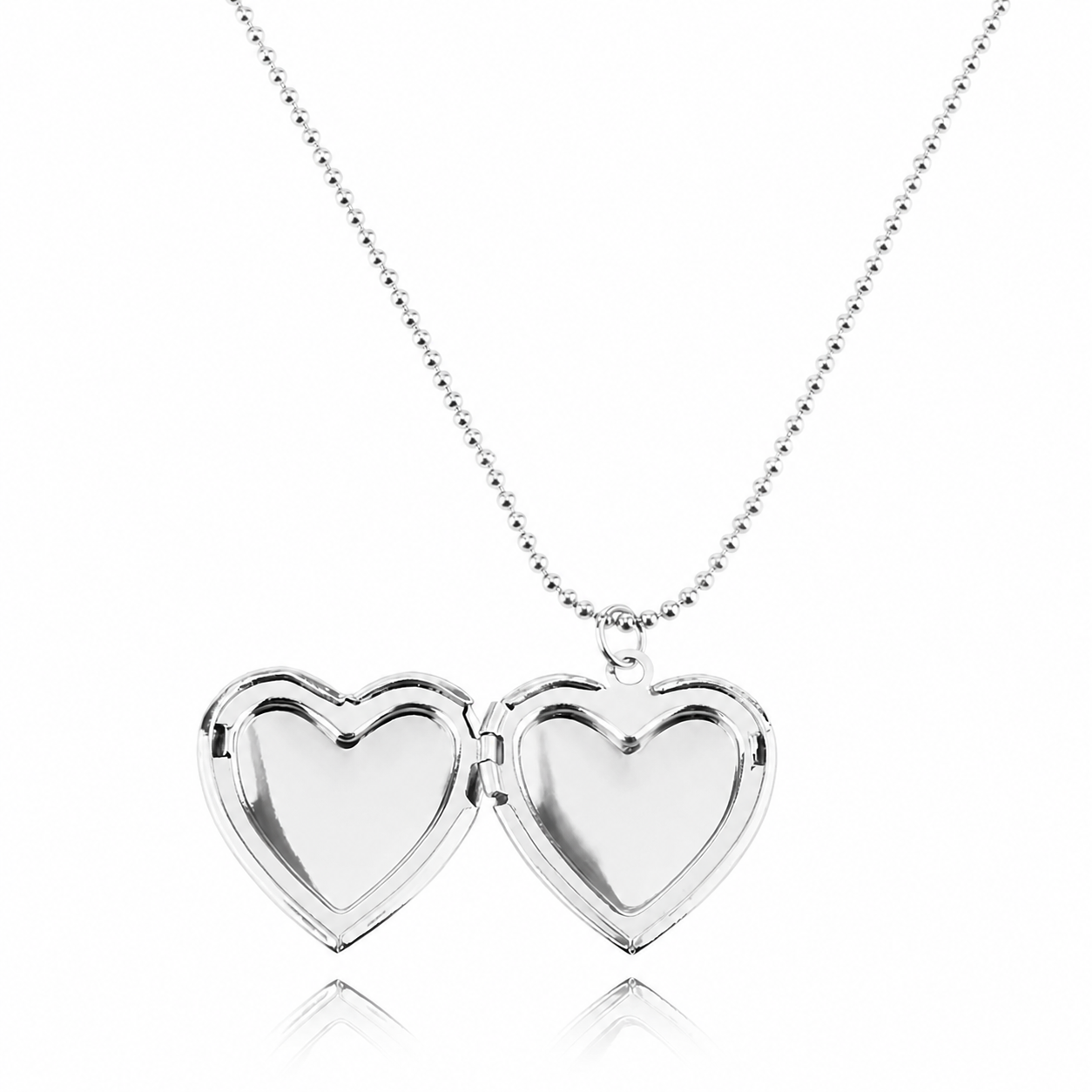 Heart-shaped silver locket necklace on a white background