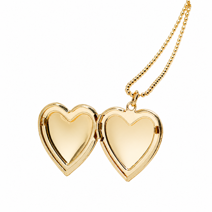 Gold heart-shaped locket on a chain against a white background