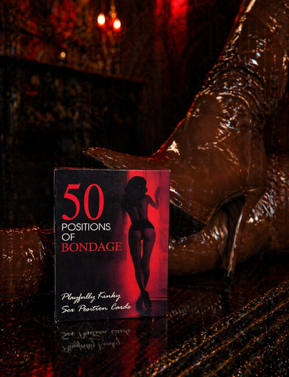 Book titled '50 Positions of Bondage' with a high-heeled shoe in the background