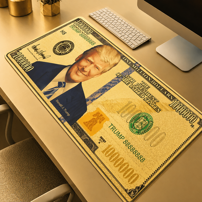 Desk setup with a large mouse pad featuring a printed portrait and design resembling a $100,000 bill.