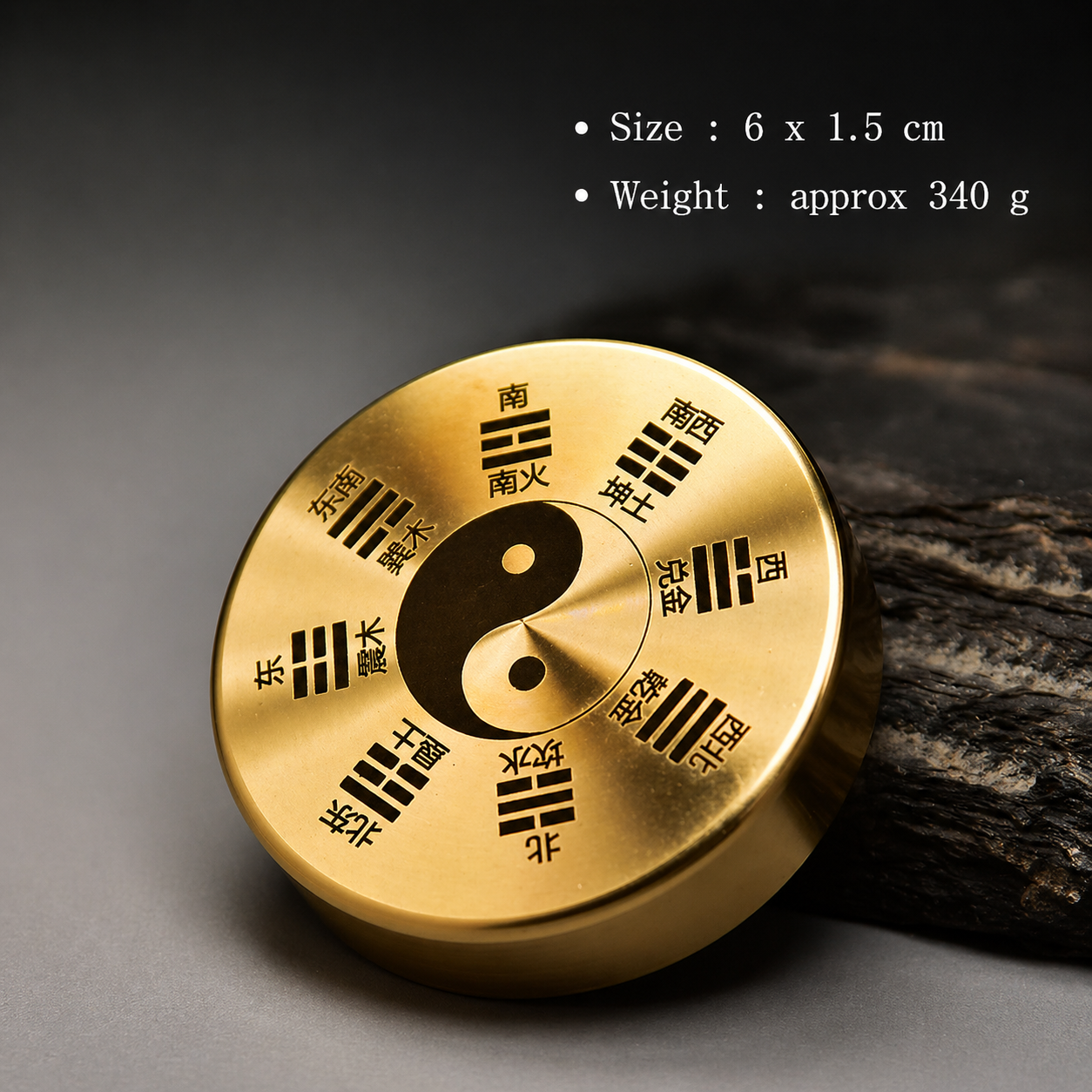 Gold circular object with symbols on a dark background