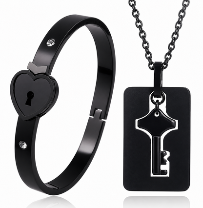 Black heart-shaped lock bracelet and key pendant necklace on a white background