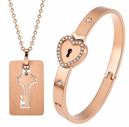 Rose gold necklace with key pendant and heart-shaped lock bracelet on a white background
