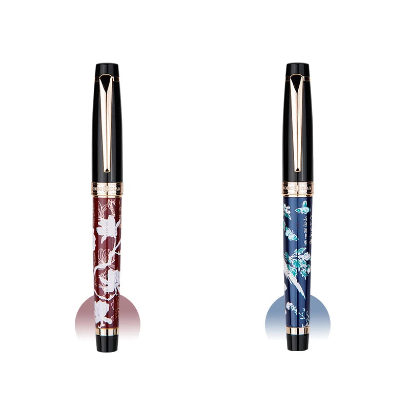 Two pens, one with floral design and one with blue floral pattern, on a white background.