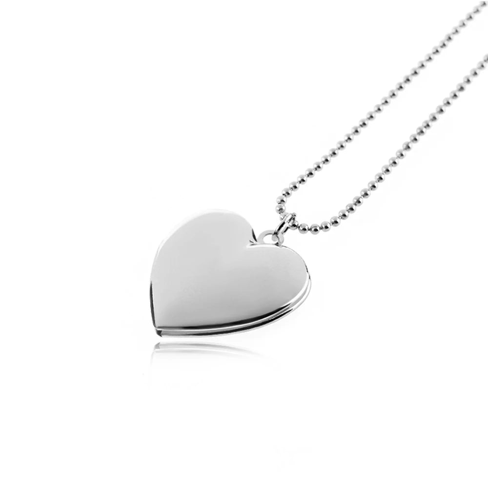 Silver heart-shaped pendant on a white background