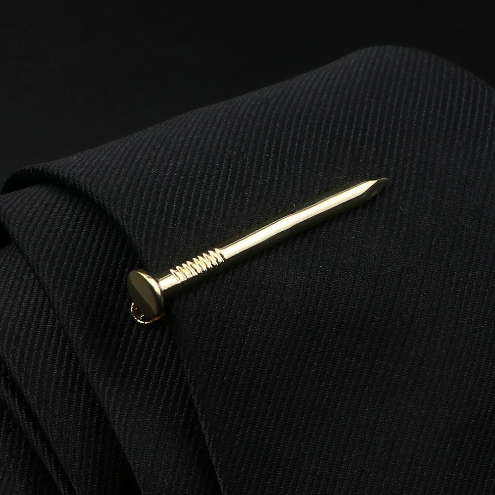 Gold nail on a black textured surface