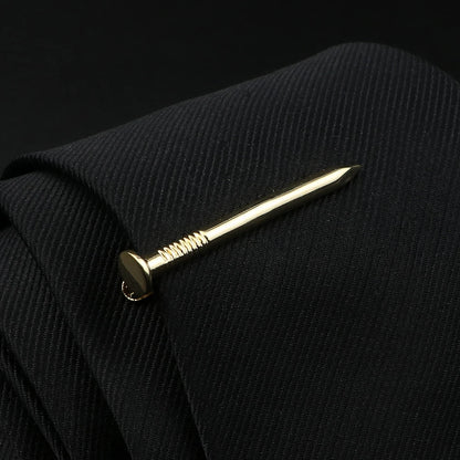 Gold nail on a black textured surface