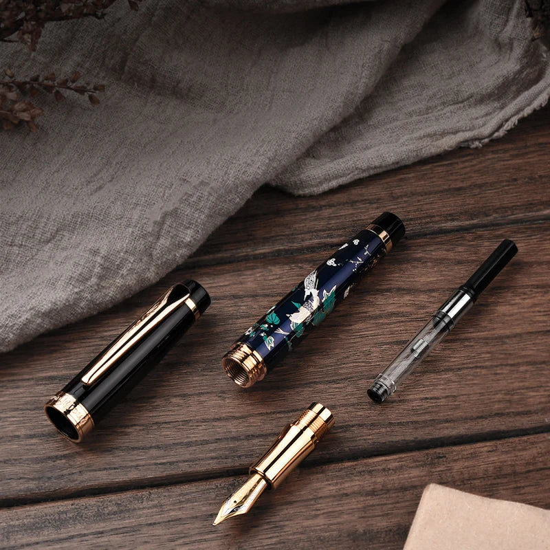 Collection of pens on a wooden surface with a gray fabric background