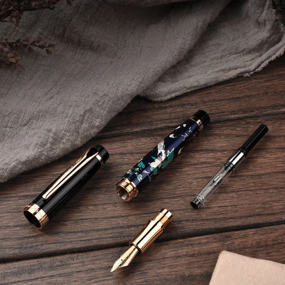 Collection of pens on a wooden surface with a gray fabric background
