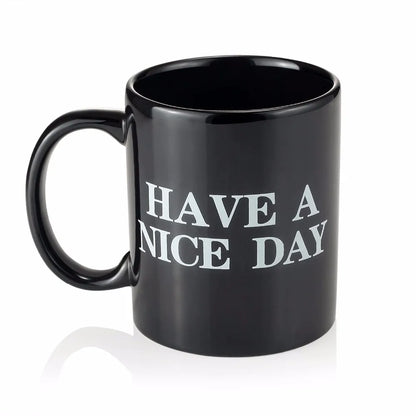 Black mug with 'HAVE A NICE DAY' text on a white background