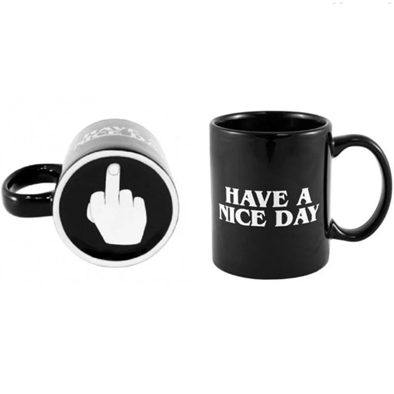 Black mug with 'Have a Nice Day' text and a ring with middle finger symbol on a white background