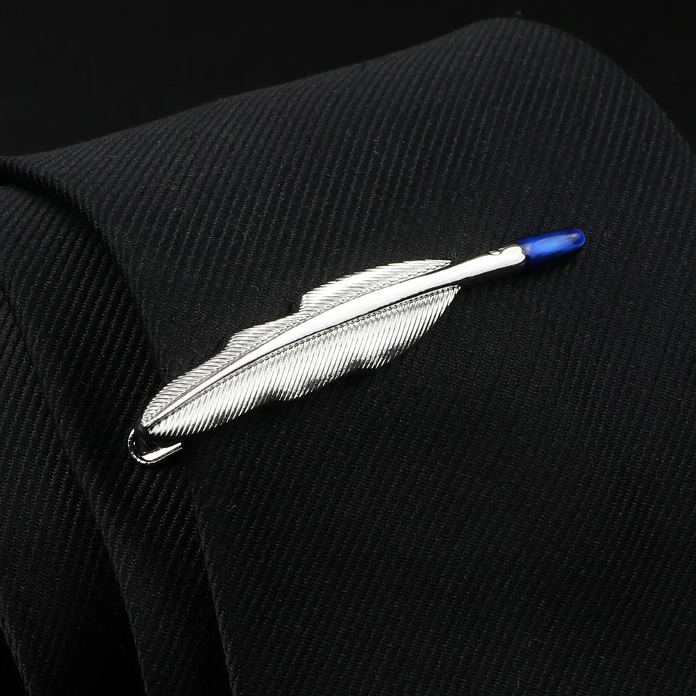 Feather-shaped lapel pin on a black suit jacket