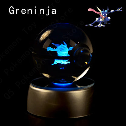 Greninja Poké Ball light with glowing blue figure inside a crystal ball on a black background.
