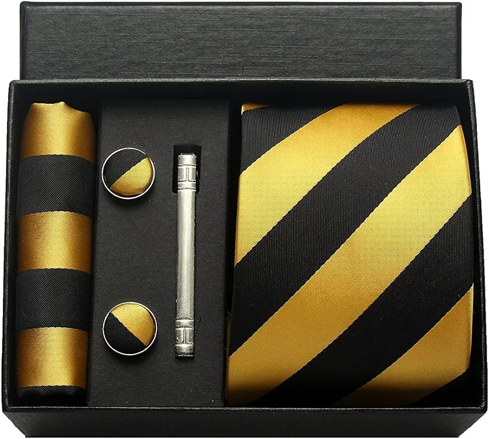 Groomsmen gift set with black and gold striped tie, pocket square, cufflinks, and pen in a box.