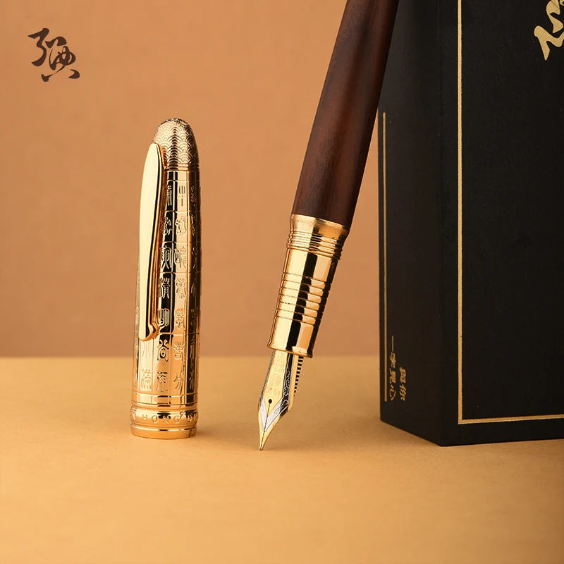 Luxury gold and brown pen with a matching box on a beige background
