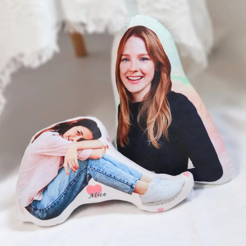 Personalized pillow with a printed image of a person and the name 'Alice' on a light background.
