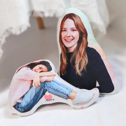 Personalized pillow with a printed image of a person and the name 'Alice' on a light background.