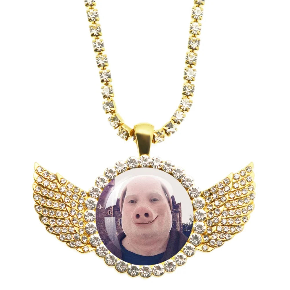 Necklace with a pendant featuring a person's face and wings, on a white background