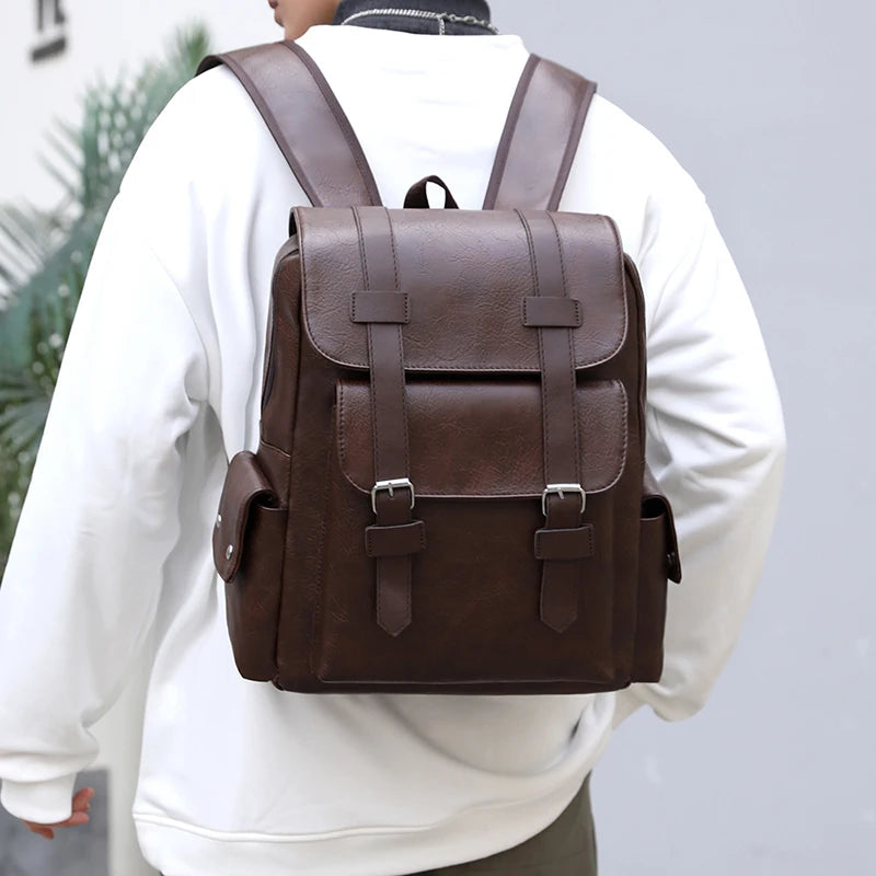 Person wearing a brown leather backpack with a blurred background