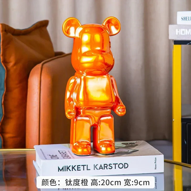 Orange bear-shaped lamp on books with a blurred background