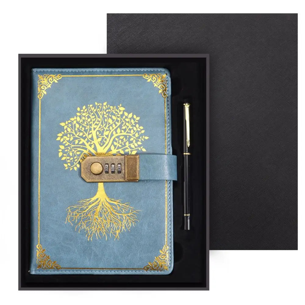 Blue notebook with gold tree design and combination lock, accompanied by a pen, in a black box.
