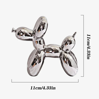 Metallic balloon dog sculpture with dimensions on a white background