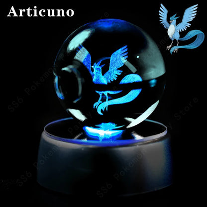 Crystal ball with glowing blue Articuno design on a black background