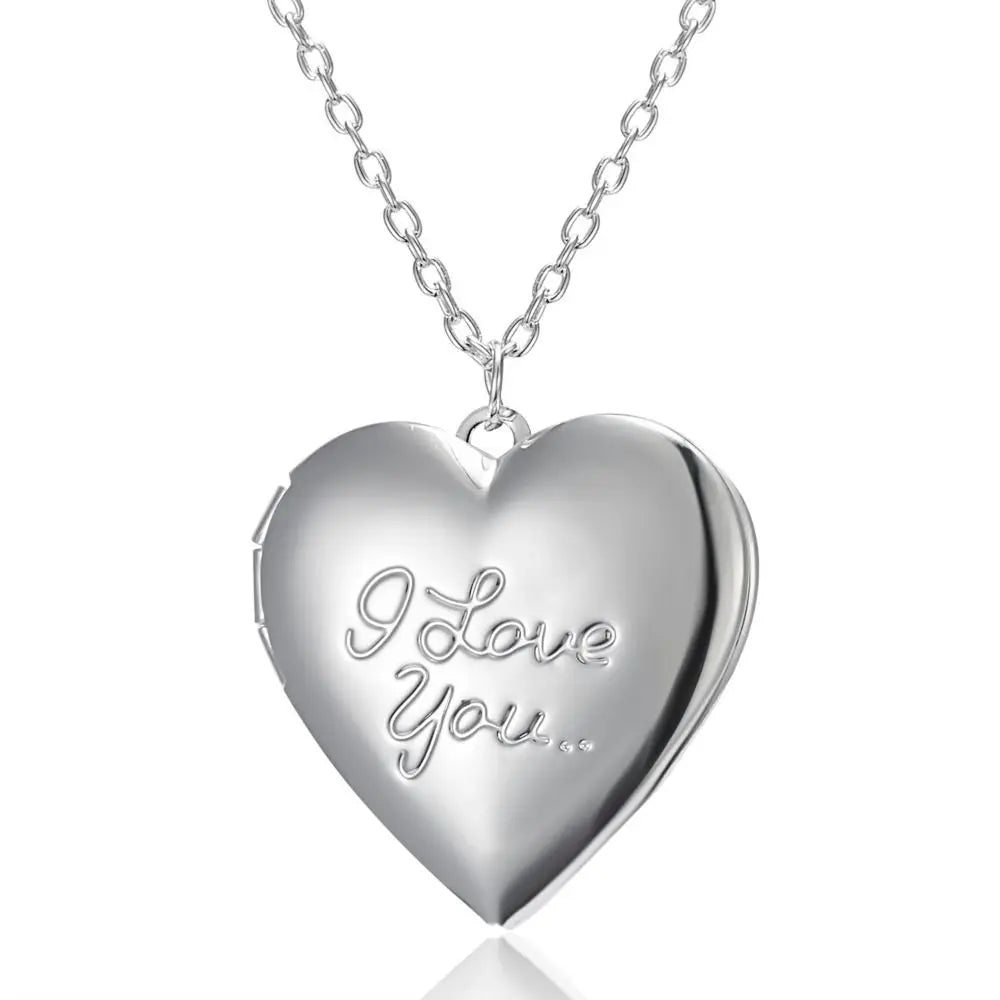 Silver heart-shaped locket with 'I Love You' engraving on a white background