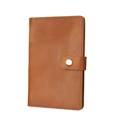 Brown leather wallet with a button on a white background