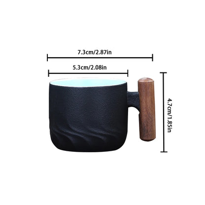 Black mug with wooden handle and measurements on a white background