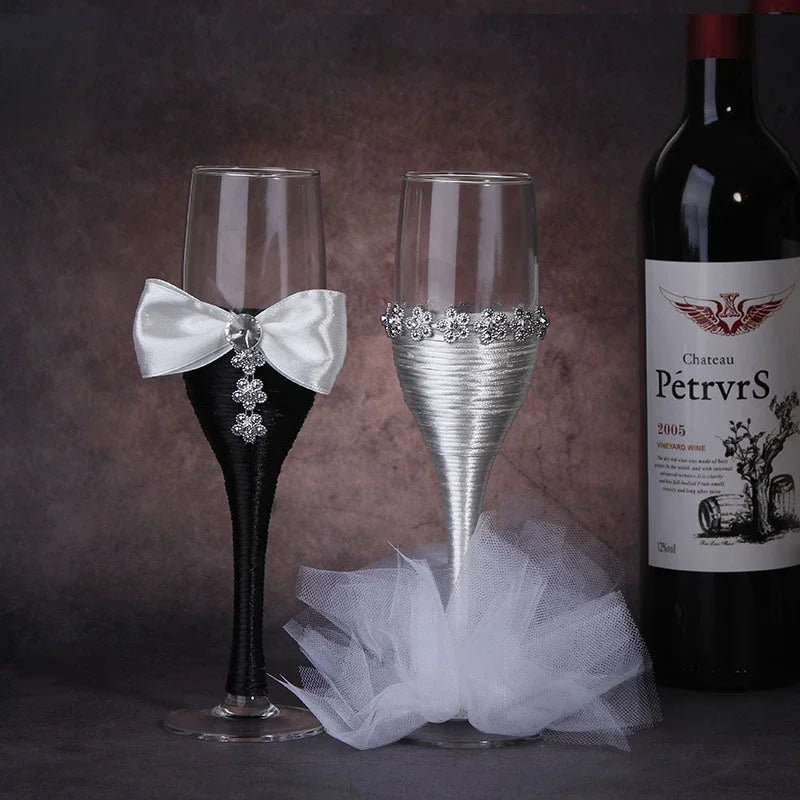Decorative wine glasses with a bottle of Chateau Petrus in the background