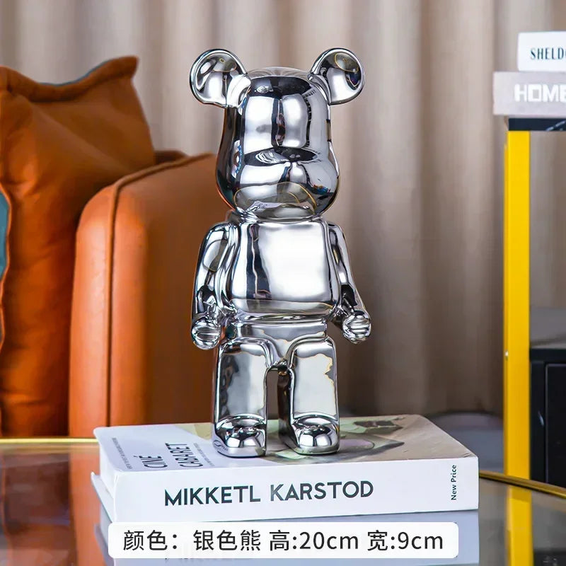 Silver bear figurine on a book with a blurred background