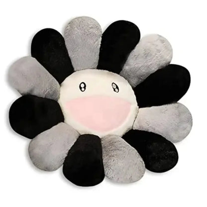 Flower-shaped plush toy with black, gray, and white petals on a white background
