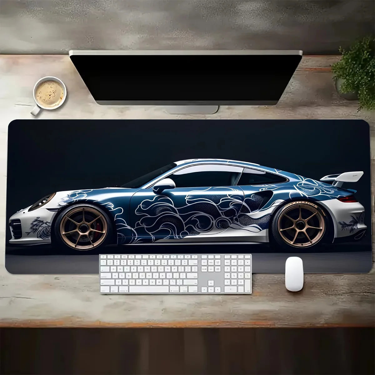 Desk setup with a car-themed mouse pad, keyboard, and mouse.