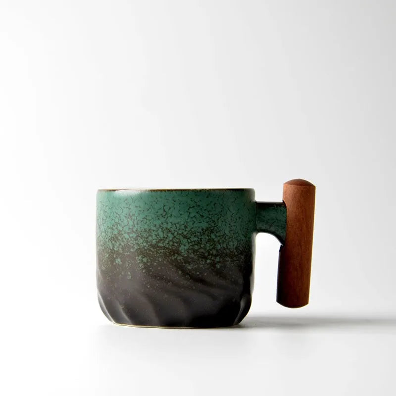 Green ceramic mug with wooden handle on a white background