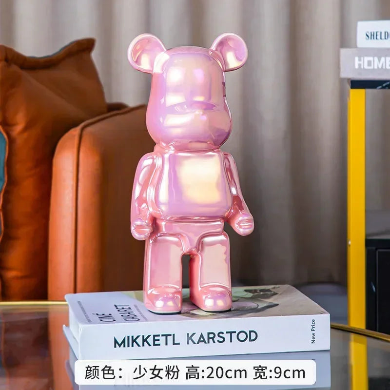 Pink teddy bear-shaped lamp on a stack of books with a blurred background