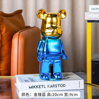 Blue and gold bear-shaped lamp on a stack of books with a blurred background