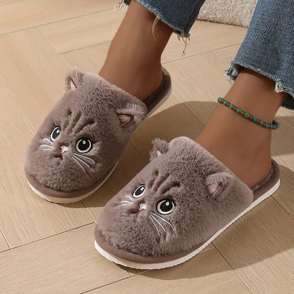 Cat-shaped slippers worn on a wooden floor