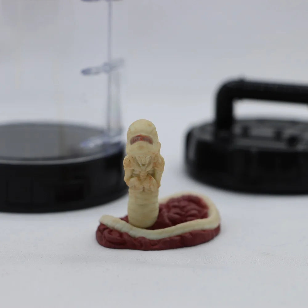 Model of a mummy on top of a brain with a 3D printer in the background