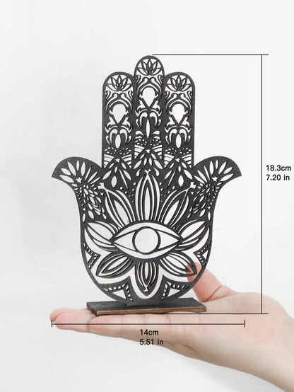Decorative Hamsa hand with intricate patterns held in a hand, showing dimensions on a white background.