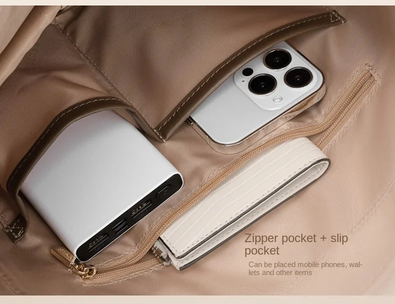 Open beige handbag with phone, wallet, and power bank inside, text indicating zipper pocket and slip pocket.