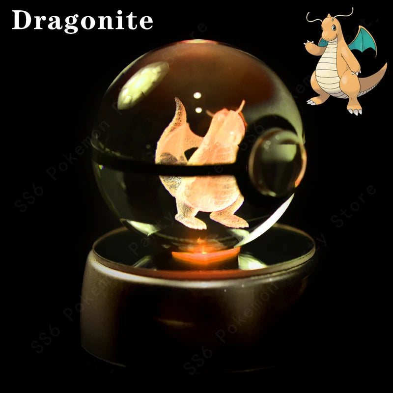 Glass ball with a 3D laser engraving of a dragon-like creature, labeled 'Dragonite', on a dark background.
