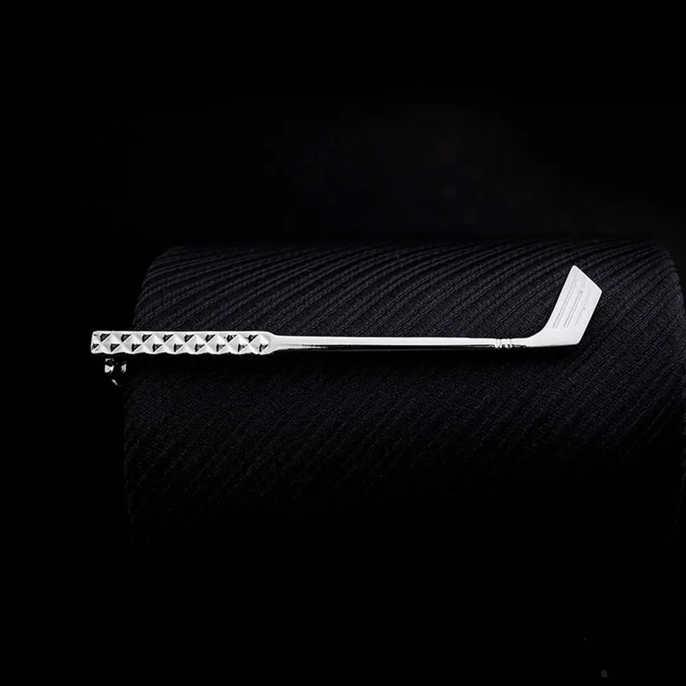 Hockey stick on a textured black surface with a dark background