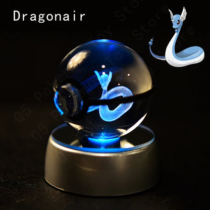 Crystal ball with blue light and Dragonair illustration on a dark background