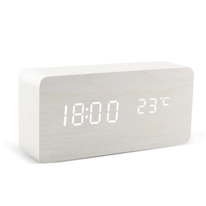 White digital clock with LED display on a white background