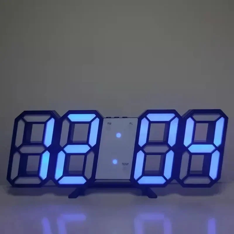 Digital clock with blue LED display on a dark background
