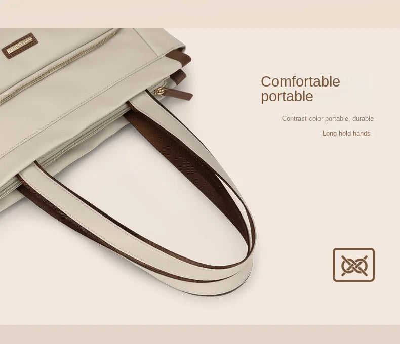Beige handbag with brown handle on a light beige background